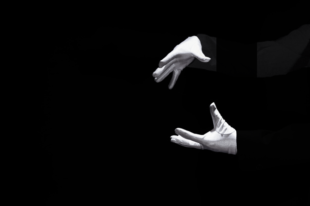 Cold dish: Against a black background, two white gloved hands appear to be strangling an invisible object