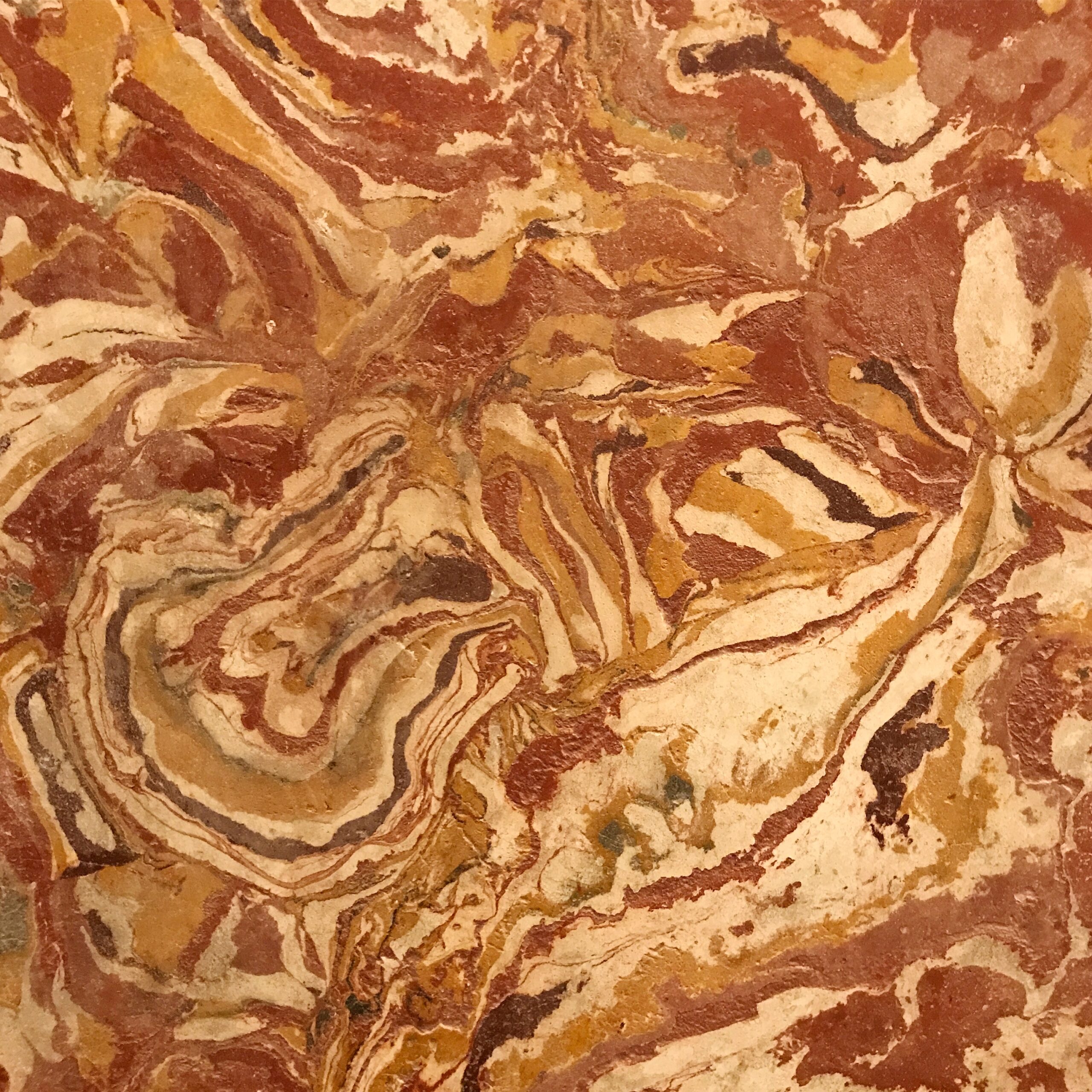 The Angel Hunters: painted swirls in red, yellow and brown